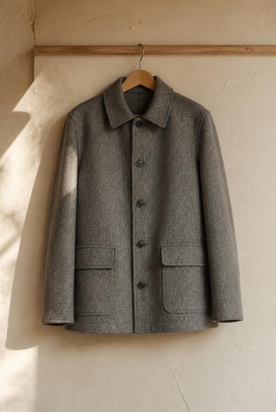 Long grey wool coat on a stone street